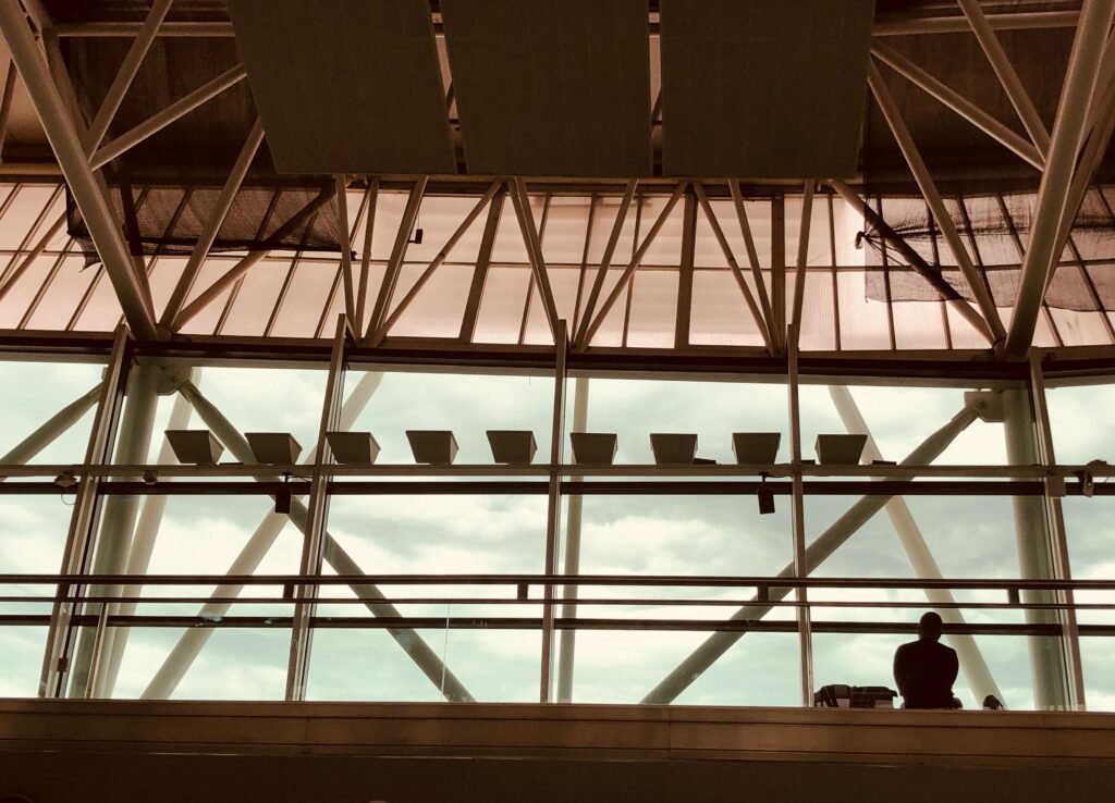 Silhouette of a person in Buenos Aires Ezeiza Airport's modern architectural design.